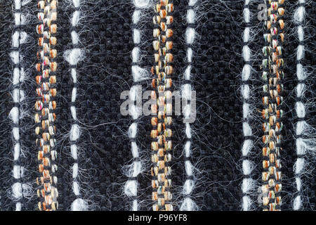 Red hand weaving matting tweed fabric texture. Closeup horizontal fragment Stock Photo