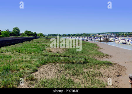 moored boats along side mudflats on the river medway Stock Photo