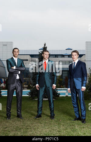 The three businessmen on megalopolis background stand Stock Photo - Alamy
