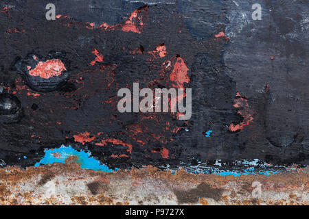Texture of rusty colourful metal background with a peeling cracked layers of paint. Stock Photo
