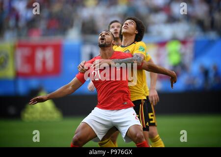 July 14th, 2018, St Petersburg, Russia. Ruben Loftus-cheek of England and Jan Vertonghen and Axel Witsel of Belgium in action during the 2018 FIFA World Cup Russia match between England and Belgium at Saint-Petersburg Stadium, Russia. Shoja Lak/Alamy Live News Stock Photo