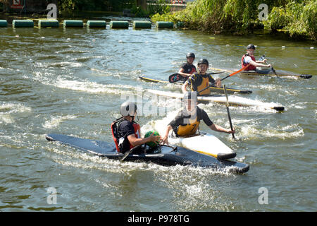 Bedford, England. 15 July 2018: Canoe water polo match between two teams on the River Ouse at the 40th River Festival in Bedford, Bedfordshire, England. Martin Parker/Alamy Live News Stock Photo