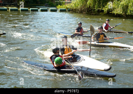 Bedford, England. 15 July 2018: Canoe water polo match between two teams on the River Ouse at the 40th River Festival in Bedford, Bedfordshire, England. Martin Parker/Alamy Live News Stock Photo