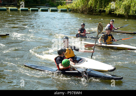 Bedford, England. 15 July 2018: Canoe water polo match between two teams on the River Ouse at the 40th River Festival in Bedford, Bedfordshire, England. Martin Parker/Alamy Live News Stock Photo