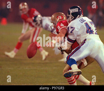 San Francisco, California, USA. 3rd Dec, 1990. San Francisco 49ers vs New  York Giants at Candlestick Park Monday, December 3, 1990. 49ers beat Giants  7-3. 49er defensive back Ronnie Lott (42) and