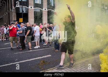 London, UK. 14th July 2018. Right-wing pro-Trump and ‘Free Tommy Robinson’ supporters protest and clash with police in Westminster as Donald Trump, the 45th President of the United States, is due to visit London as part of his official UK visit. Credit: Guy Corbishley/Alamy Live News Stock Photo
