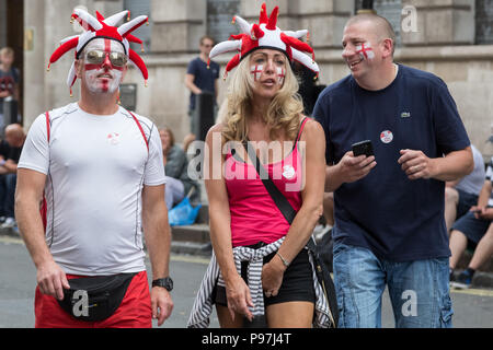London, UK. 14th July 2018. Thousands of pro-Trump supporters join with 'Free Tommy Robinson' protesters to rally in Whitehall. Credit: Guy Corbishley/Alamy Live News Stock Photo