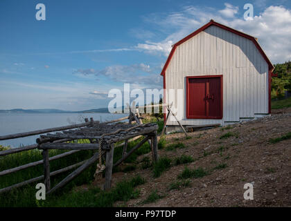 Old-fashioned barn with cod fish drying rack Stock Photo