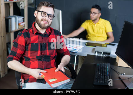 Creative Young IT Developer Posing in Office Stock Photo