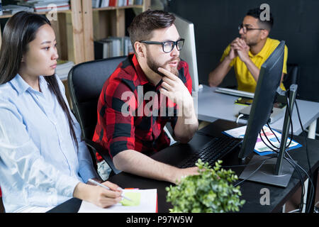 Creative Young Team Working in Office Stock Photo