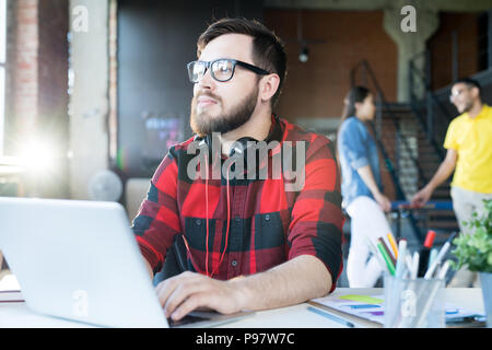 Modern Bearded Man in Coworking Space Stock Photo