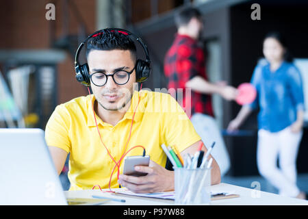 Contemporary Middle-Eastern Man Working in Office Stock Photo