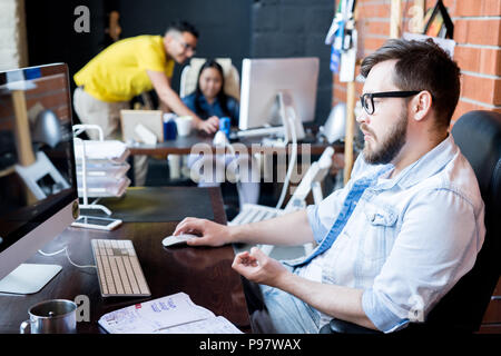Contemporary Man Working in Office Stock Photo