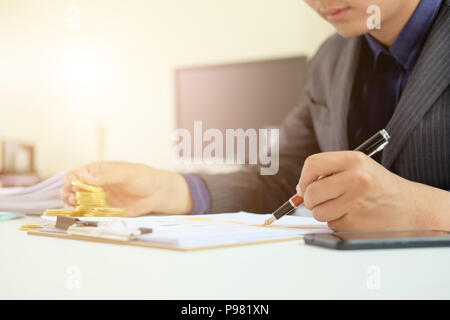 Man working on spreadsheet document financial data,Certified public accountant. Stock Photo