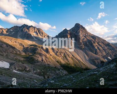 Massif des Ecrins (4101 m), France. Colorful sky at sunrise, majestic peaks and glaciers, dramatic landscape. Stock Photo