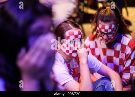 Los Angeles, USA. 15th July, 2018. Fans of Croatia react as they watch the 2018 FIFA World Cup final match between France and Croatia at a viewing party in Los Angeles, the United States, on July 15, 2018. Croatia lost to France 2-4 in the final and won the second place of the 2018 FIFA World Cup. Credit: Zhao Hanrong/Xinhua/Alamy Live News Stock Photo