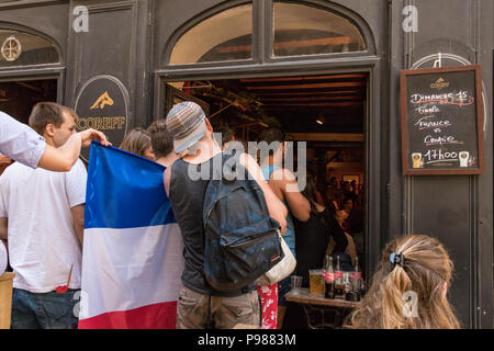 Saint-Malo, France - July 15th, 2018: People watching the final world cup match Croatia France in a Bar inside the Walled City at the historic French port  Saint Malo in Brittany on the Channel coast. Credit: Ruben Ramos/Alamy Live News. Stock Photo
