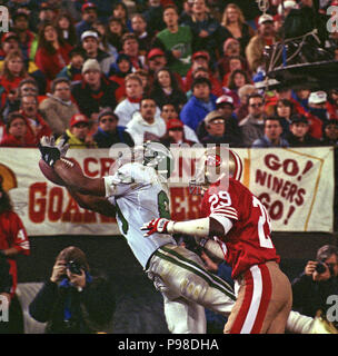 San Francisco 49ers Don Griffin (29) and Tim McKyer (22) celebrate after  breaking up a Denver Broncos pass from John Elway to wide receiver Mark  Jackson, right, during Super Bowl XXIV in