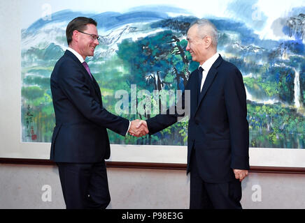 Beijing, China. 16th July, 2018. Chinese Vice Premier Liu He (R), also a member of the Political Bureau of the Communist Party of China Central Committee, meets with European Commission Vice President Jyrki Katainen, who is here to attend the 20th China-EU leaders' meeting, in Beijing, capital of China, July 16, 2018. Credit: Yan Yan/Xinhua/Alamy Live News Stock Photo
