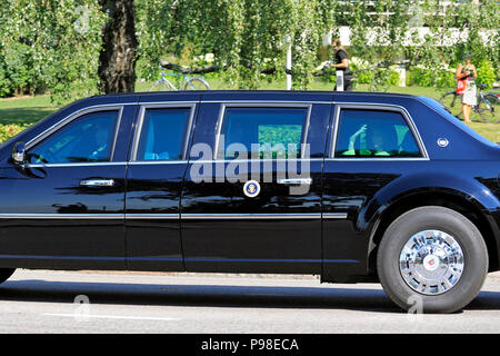 Helsinki, Finland. July 16, 2018. The motorcade of US President Donald Trump and First Lady Melania Trump passes along Ramsaynranta ahead of US and Russian Presidents' historic meeting. First Lady Melania Trump waves to the crowd; President Trump shows partly in profile. Credit: Taina Sohlman/Alamy Live News Stock Photo