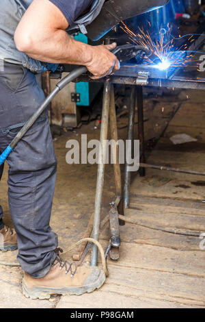 Welding work going on at a repair Stock Photo