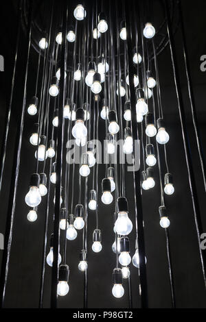 installation group of light bulbs in the dark Loft style Stock Photo