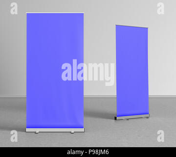 Blank blue roll up banner stands on gray floor. Include clipping paths around stand and ad banner. 3d render Stock Photo