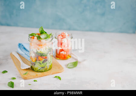 Tasty served salad wuth prawns in jar on table. Ready to eat. Detox Clean Eating Concept Stock Photo