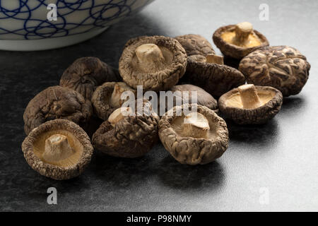 Heap of dried shiitake mushrooms close up Stock Photo