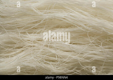 Raw white rice noodles close up full frame Stock Photo