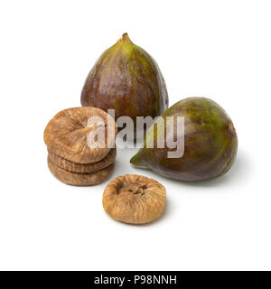 Fresh ripe figs and a heap of dried ones isolated on white background Stock Photo