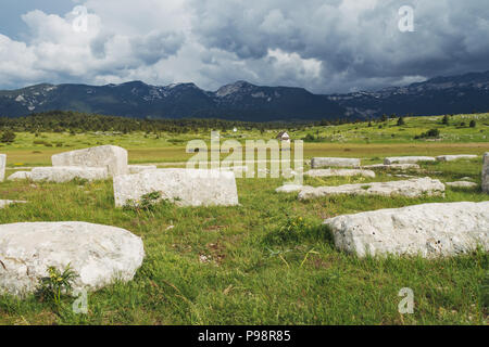 The white Dugo Polje necropolis with over 130 white stećak (tombstones) in Blidinje, Bosnia and Herzegovina Stock Photo