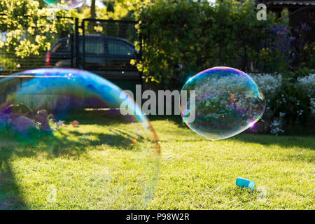 big soap bubbles in the garden Stock Photo
