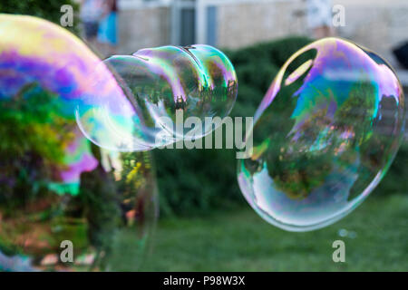 big soap bubbles in the garden Stock Photo