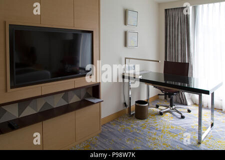 Television and desk in a bedroom at the Cinnamon Grand Hotel in Colombo, Sri Lanka. The luxury hotel is near the Fort area.