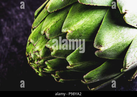 ARTICHOKE. Close up of artichoke, top view, dark background. Macro Stock Photo