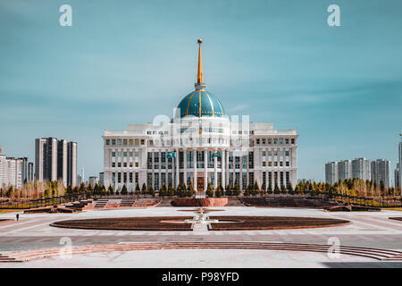 Presidential palace 'Ak-Orda' with blue sky across river in Astana, Kazakhstan Stock Photo