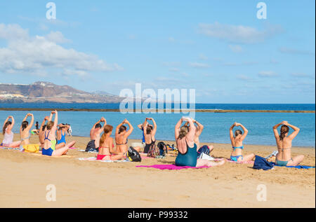 Saturday morning beach Yoga class on Playa de Las Canteras in Las Palmas on Gran Canaria,Canary Islands, Spain Stock Photo