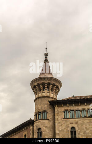One of two towers of Municipal Conservatory of Barcelona with pointed top reminiscent of the 15th century castles. The brick and stone building was co Stock Photo