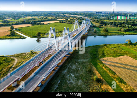 New modern double cable-stayed bridge over Vistula River in Krakow, Poland. Part of the ring motorway around Krakow under construction. Aerial view at Stock Photo