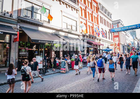 people walking on a busy street in quebec city Stock Photo
