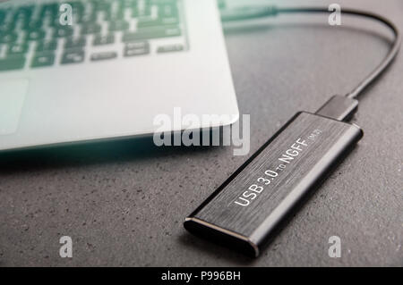 beton tromme Frugtgrøntsager Adapter from the M.2 SSD to USB 3.0 is connected to a modern laptop Stock  Photo - Alamy