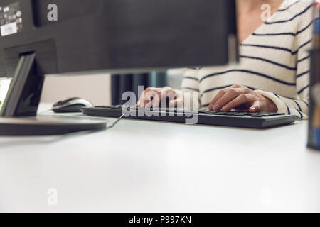 Businesswoman using computer in office. Freelance, workplace concept Stock Photo