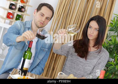 wine loving couple tasting wines in winery cellar Stock Photo