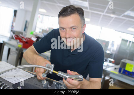 worker with device in household department Stock Photo