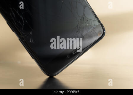 MINSK, BELARUS - JULE 13, 2018: Shattered display of the phone Xiaomi Redmi 3 PRO during a fall to the floor at the shopping center in Minsk Stock Photo