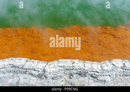 Detail of the edge of the Champagne pool, Wai-O-Tapu geothermal area, New Zealand North Island. The orange colour originates from deposits of arsenic. Stock Photo