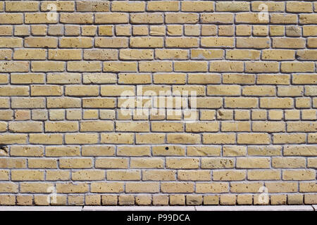 Rustic old white beige brick wall background in common bond pattern with grunge look Stock Photo