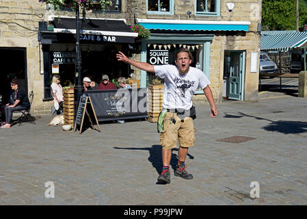 Spike, a street performer in Hebden Bridge, Calderdale, West Yorkshire, England UK Stock Photo