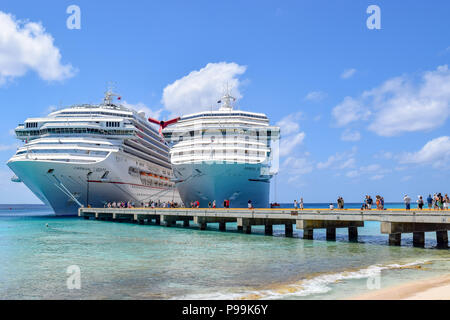 Grand Turk, Turks and Caicos Islands - April 03 2014: Carnival Liberty and Carnival Victory Cruise Ships moored at the Grand Turk Cruise Terminal. Stock Photo